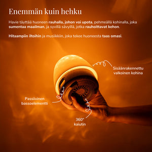 Havie, jossa on sisäänrakennettu valkoinen kohina ja 360 asteen kaiutin, levittää lämmintä oranssia hehkua.